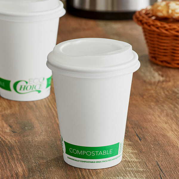 Two EcoChoice white compostable paper hot cups with PLA lids on a table.