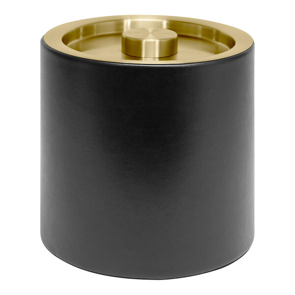 A black cylinder with a matte brass top.