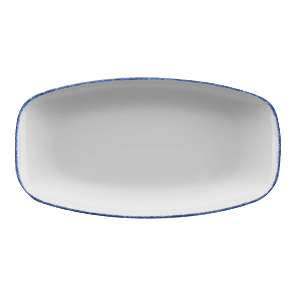 A white rectangular porcelain platter with a sponged blue rim.