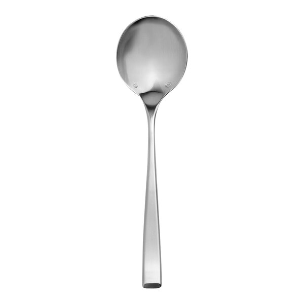 A close-up of a Chef & Sommelier stainless steel soup spoon with a long handle.