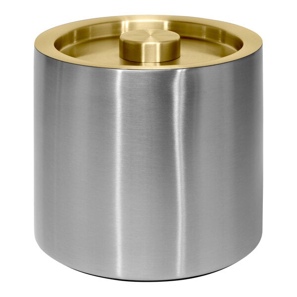 A silver stainless steel cylindrical ice bucket with a matte brass lid.