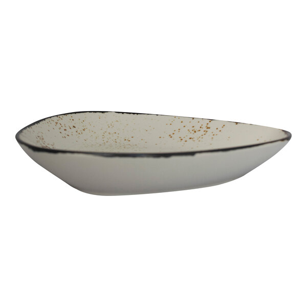 A white triangular stoneware bowl with brown specks.