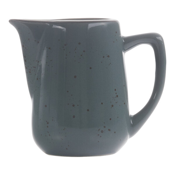 A grey International Tableware creamer with speckled dots and a handle.