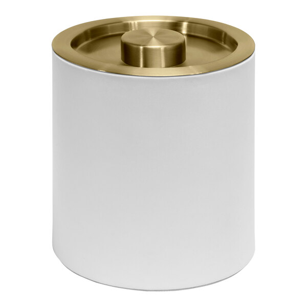 A white metal cylinder with a matte brass lid.