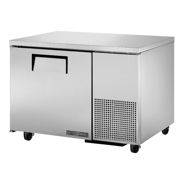 A stainless steel True undercounter refrigerator with wheels.