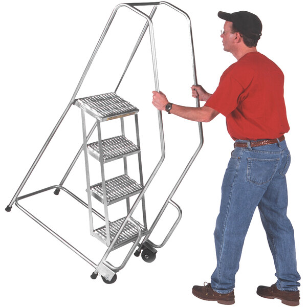 A man pushing a Ballymore aluminum safety ladder with 5 steps and a handrail.