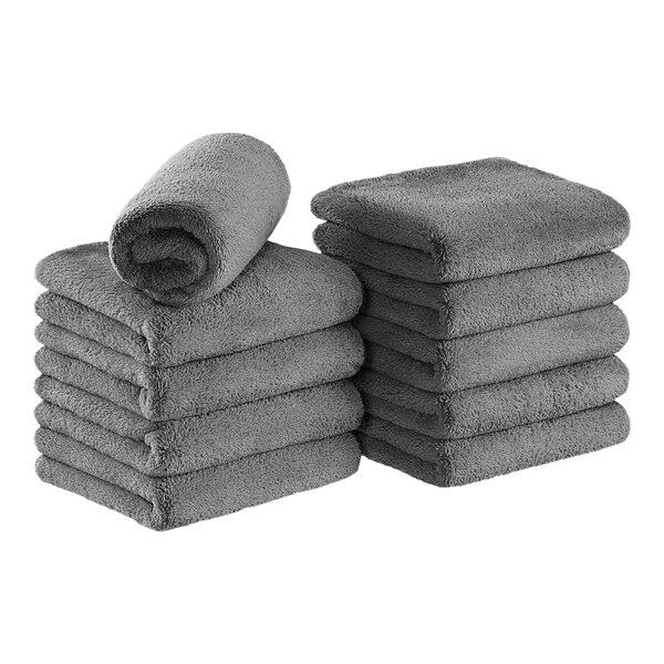 A stack of Monarch Brands gray coral fleece hand towels.