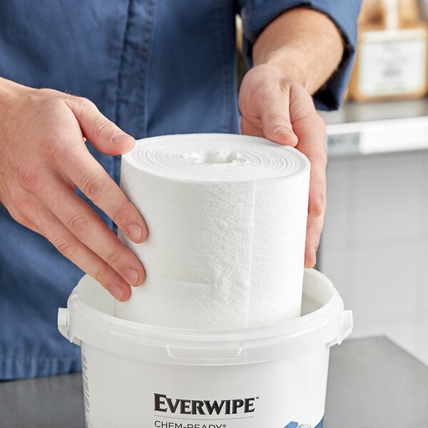 A person holding an Everwipe Chem-Ready refill wiping roll.