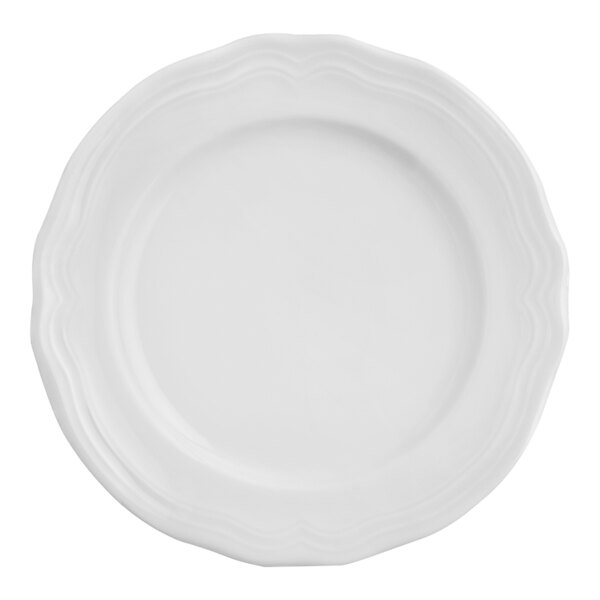 An Arcoroc Athena white porcelain plate with a scalloped edge.