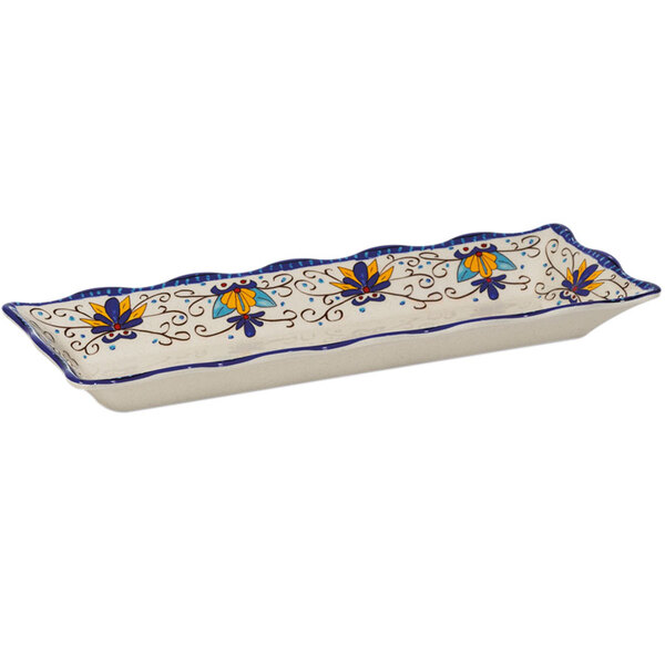 A white rectangular melamine tray with a blue and yellow scalloped design.