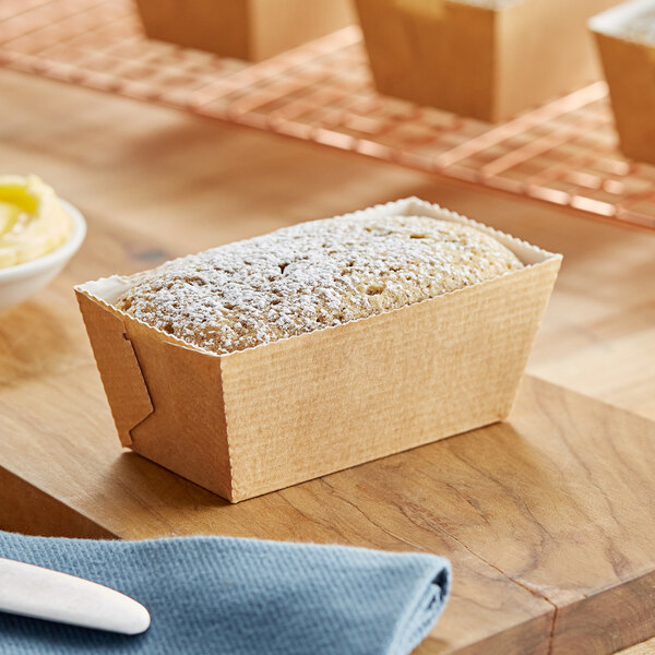 A loaf of bread in a corrugated paper mold.