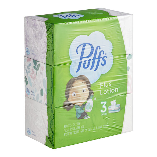 A white and blue Puffs Plus Lotion 3-pack of facial tissue boxes.