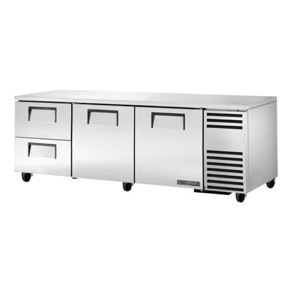 A large stainless steel True undercounter refrigerator with two doors and two drawers.