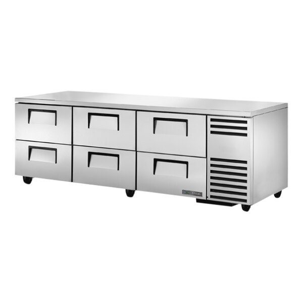A stainless steel True undercounter refrigerator with six drawers.