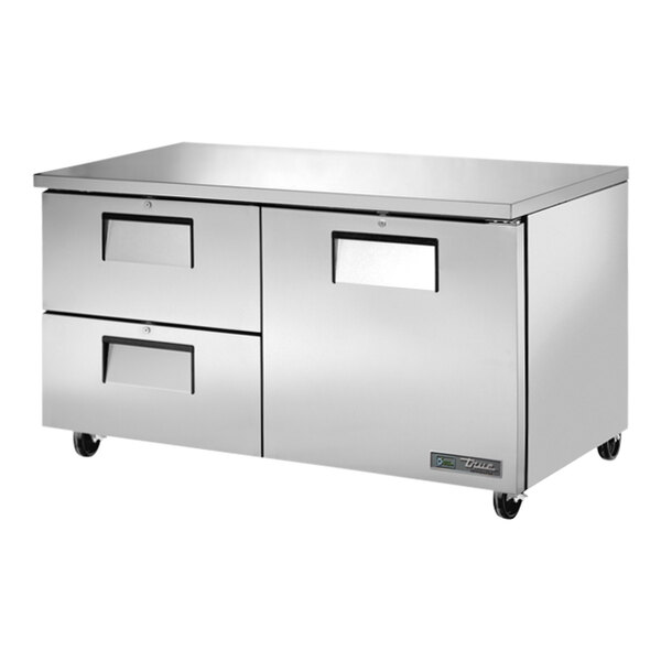 A stainless steel True undercounter refrigerator with drawers.