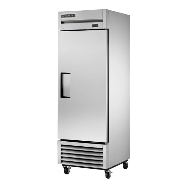 A stainless steel True refrigerator/freezer with a black handle.