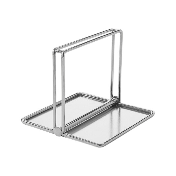 A stainless steel rectangular napkin holder with a handle.