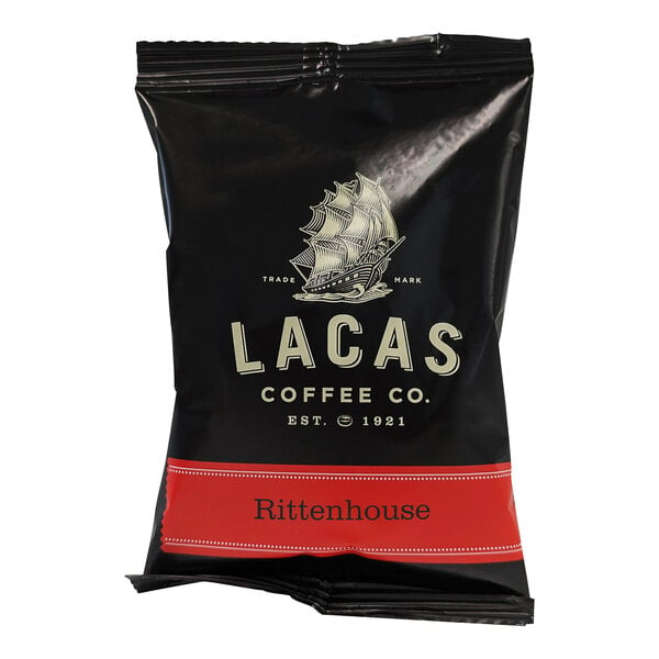A black Lacas Coffee packet with white text and a boat.