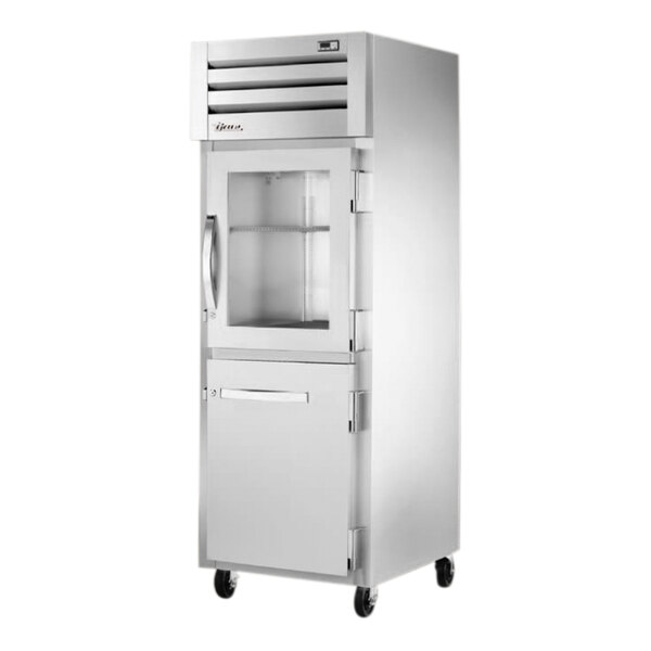 A True white reach-in refrigerator with a glass and solid half door.
