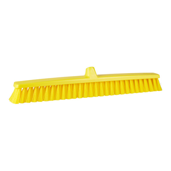 A Remco yellow brush head for a long handle.