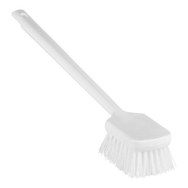A close-up of a Remco white washing brush with long stiff bristles and a long handle.