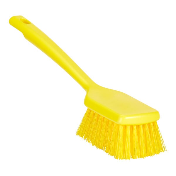 A yellow Remco ColorCore washing brush with a short handle.