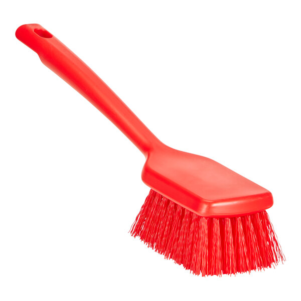 A red Remco ColorCore washing brush with a short handle.