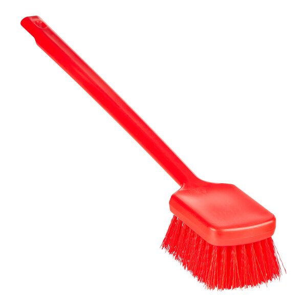 A red Remco washing brush with a long handle.