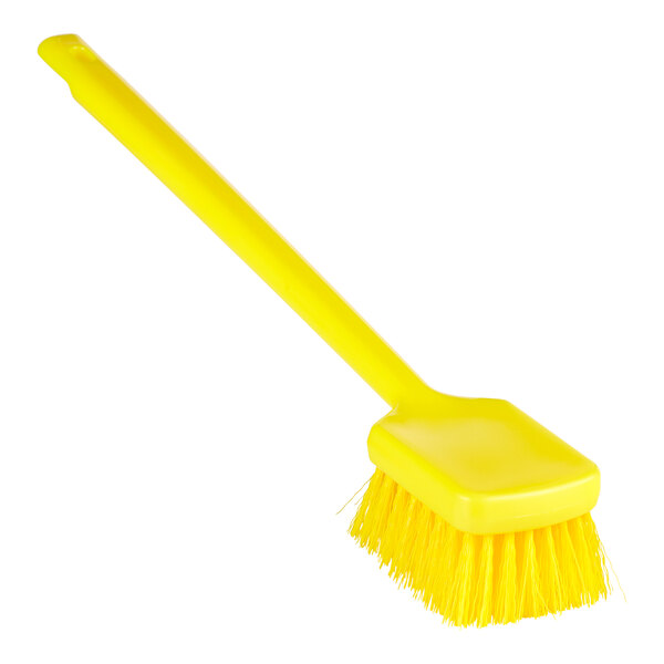 A close up of a yellow Remco ColorCore washing brush with a long handle.