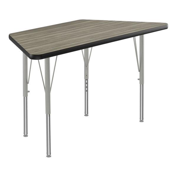 A trapezoid-shaped table with silver metal legs and a black top.