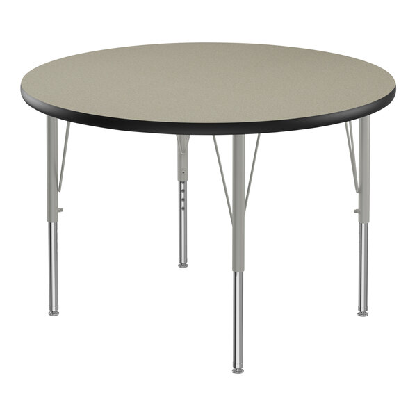 A round Correll activity table with silver legs and a black edge.