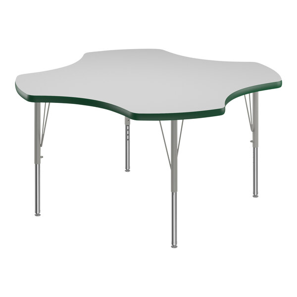 A white table with a green edge and silver legs.