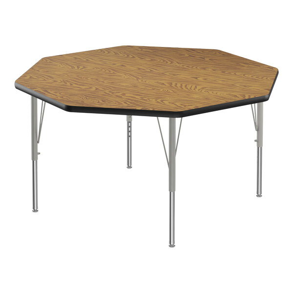 A Correll medium oak activity table with silver legs and a black edge.