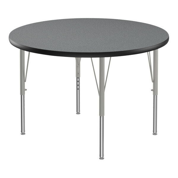 A round grey activity table with black edges and silver legs.