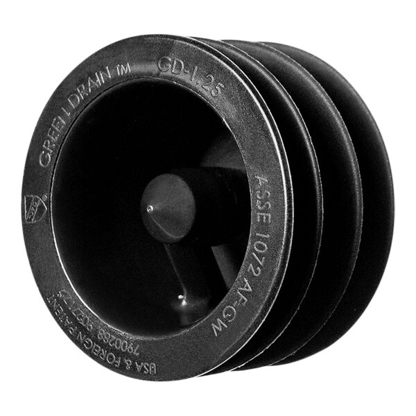 A close-up of a black round plastic Green Drain trap seal with two holes.
