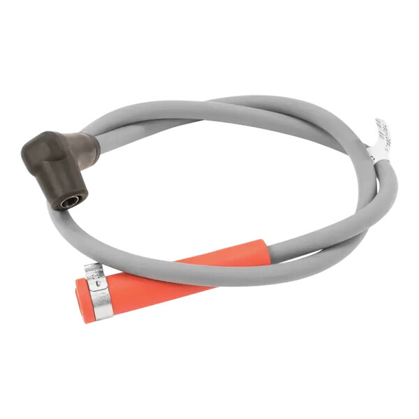 A grey and orange Frymaster ignition cable with a red connector.