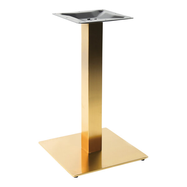 A gold square pedestal for an Art Marble Furniture bar height table.