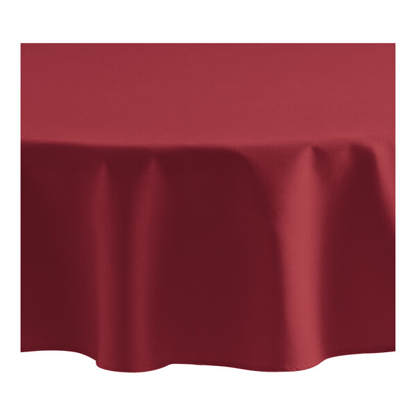 Oxford 72" Round Burgundy 100% Spun Polyester Hemmed Edge Cloth Table Cover - 12/Case