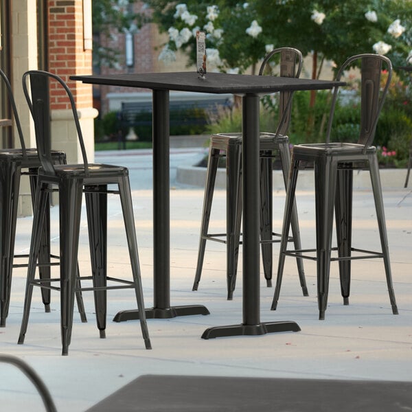 Lancaster Table & Seating Excalibur 27 1/2" x 47 3/16" Rectangular Smooth Paladina Bar Height Table with 4 Alloy Series Onyx Black Outdoor Cafe Barstools