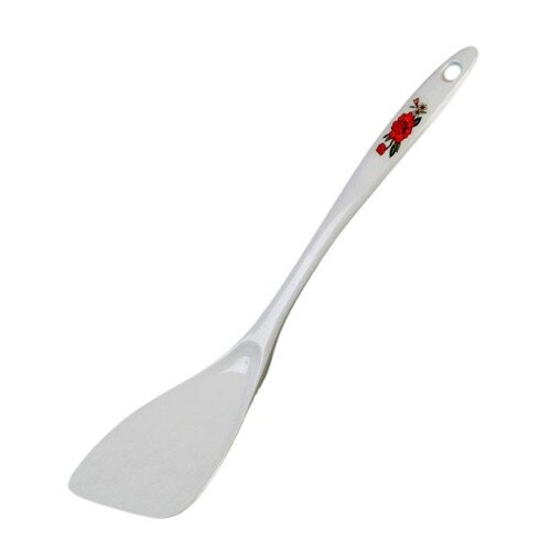 A white plastic spatula with a red flower design.