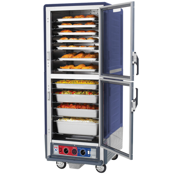 A blue Metro C5 heated holding and proofing cabinet with food inside.