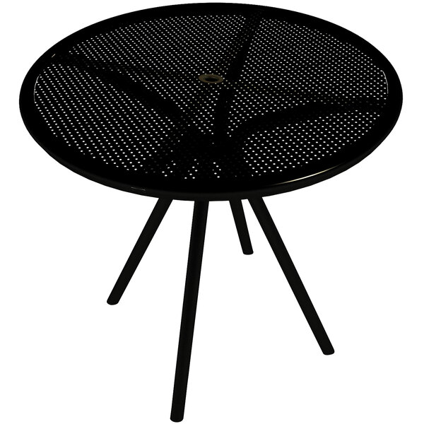 An American Tables and Seating black round table with umbrella hole and legs.