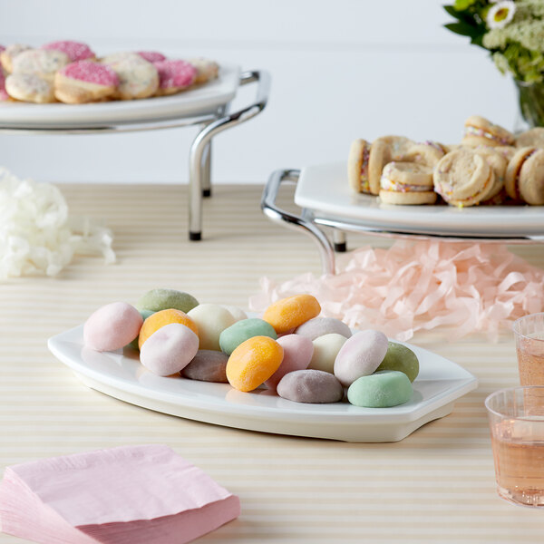A white Vollrath melamine platter holding cookies on a table.