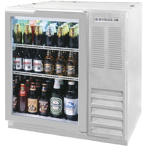A Beverage-Air back bar refrigerator with glass doors full of beer bottles.
