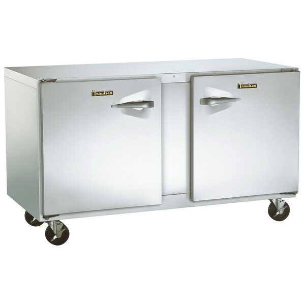 A Traulsen stainless steel undercounter refrigerator with left and right hinged doors on wheels.