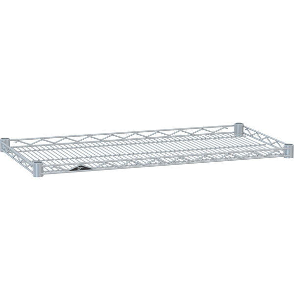 A white Metro Super Erecta wire shelf with a white metal drop mat on it.