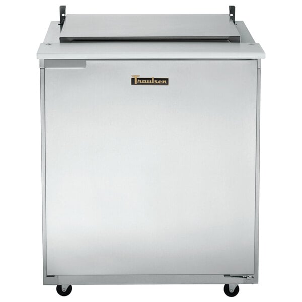 A stainless steel Traulsen refrigerated sandwich prep table with one right hinged door.