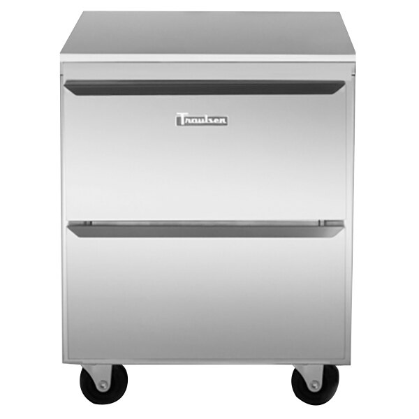 A stainless steel Traulsen undercounter refrigerator with two drawers on wheels.