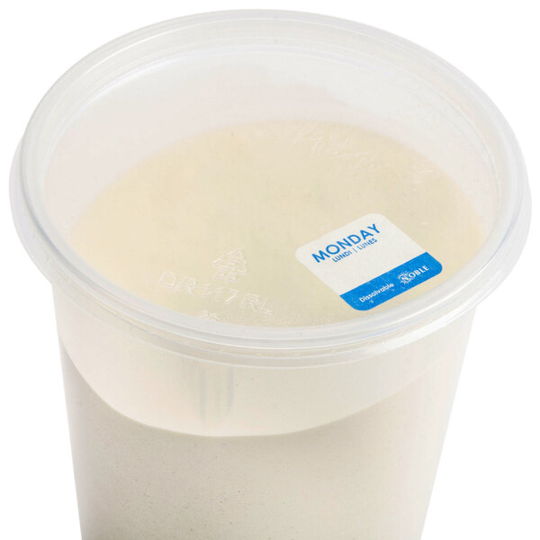 A plastic container with a Noble Products white and blue label with blue text containing a white substance.