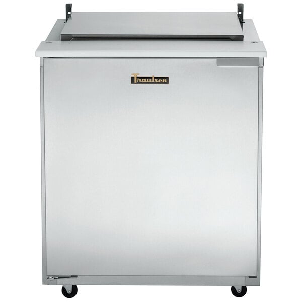 A stainless steel Traulsen refrigerated sandwich prep table with a top shelf.